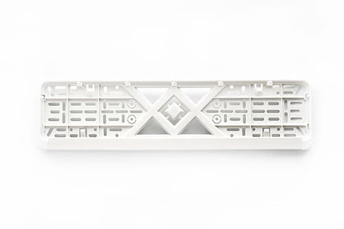 Рамка номерного знаку пластикова біла (без написів, защіпка знизу) 12 Atelie